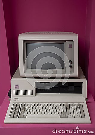 IBM personal computer (1981) is the first microcomputer released in the IBM PC model line. Pink background.. Editorial Stock Photo