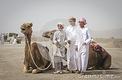 Young men with their camels bifore a race Editorial Stock Photo
