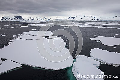 Ice in the Antarctica with iceberg in the ocean Stock Photo