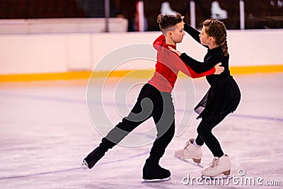 Children-athletes learn pair figure skating. dance elements Stock Photo