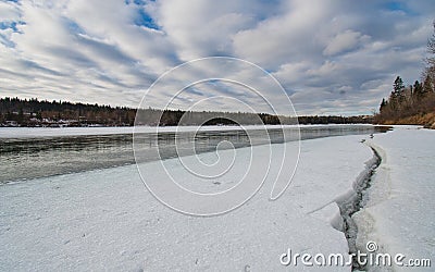 Ice breaking up along the river bank Stock Photo