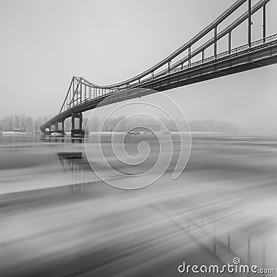 Ice is broken. Footbridge in winter city. Stock Photo