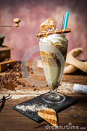Ice caffe in a glass cup on a wooden table. Stock Photo