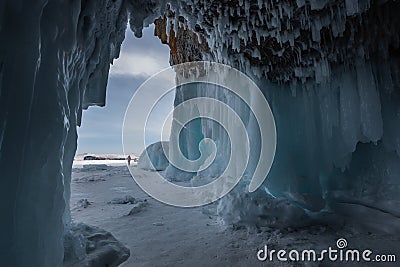 Ice cave, Icicles in the rocky caves, Lake Baikal in winter, Siberia Stock Photo
