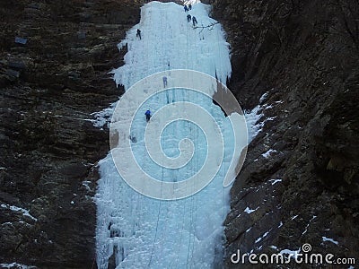 Ice climber climbing frozen water of kangchon waterfall in Chunc Stock Photo