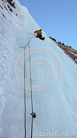 Ice climber on the headwall of the Throne icefall in the Avers Valley Stock Photo