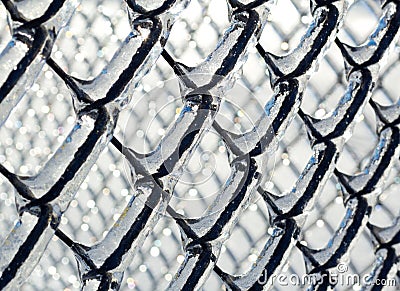 Ice coated chain link fence from an ice storm Stock Photo