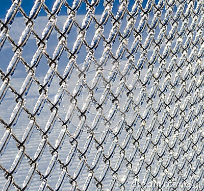 Ice coated chain link fence from an ice storm Stock Photo