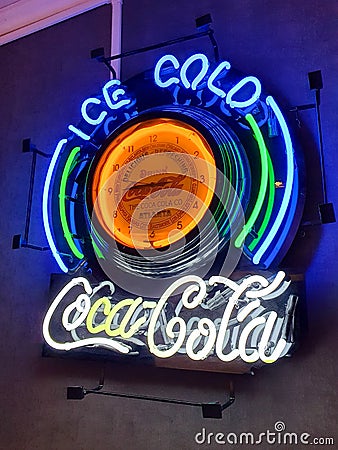 Coca Cola, Neon sign with Old clock inside Editorial Stock Photo