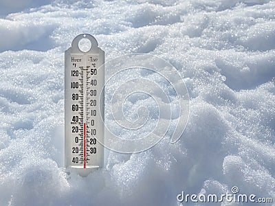 Ice cold thermometer in snow Stock Photo