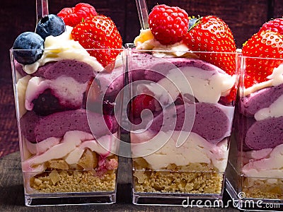 Ice cream, berries, strawberry, blueberry, raspberry, pistachios, nuts, sorbet, jam and biscuit, summer dessert, sweet snack Stock Photo