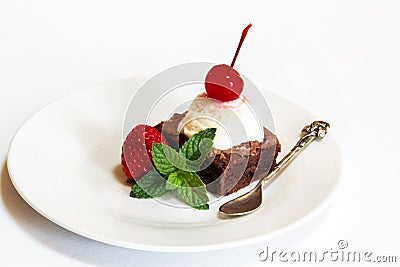 Ice cream and browny with cherry and mint Stock Photo
