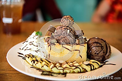 Ice cream chocolate banana place it on a wooden table. Stock Photo