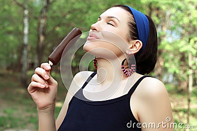 Ice cream. Cute and cheerful woman with ice cream in hand. Tasty Stock Photo