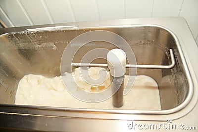Ice cream making process at ice cream factory, milk and cooking mixing milk in pasteurization machine preparing basis. Stock Photo