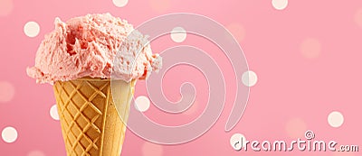 Ice cream. Strawberry or raspberry flavor icecream in waffle cone over pink polka dots background Stock Photo