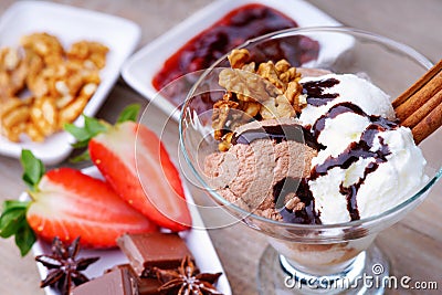 Ice cream sundae, chocolate, jam and sliced strawberry Stock Photo