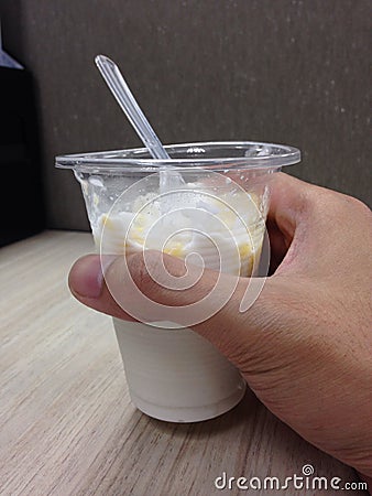Ice creem coconut milk in hand Stock Photo