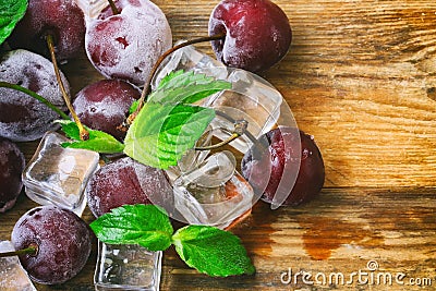 Ice cubes, frozen cherry, mint leaves macro Stock Photo