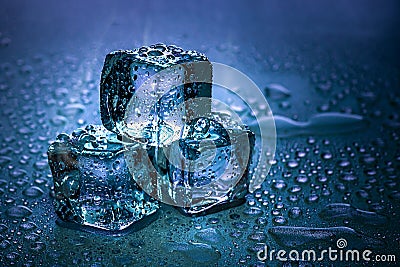 Ice cubes and water melt on cool background. Ice blocks with cold drinks or beverage Stock Photo