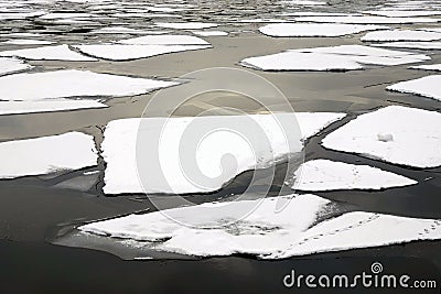 Ice drift broken ice floes floating on the river Stock Photo