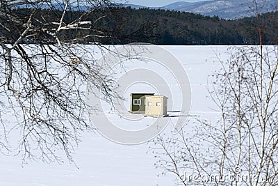 Ice Fishing in Bob Houses on Snow Covered Lake in New Eng;and Stock Photo