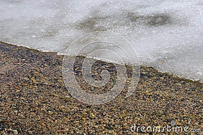 Melting snow and ice on a lake -front cover for ice-fishing or winter Stock Photo