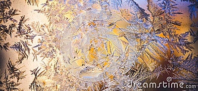 Ice flowers frozen on window. Winter cold textured pattern. Macro view. Frost crystal. Stock Photo
