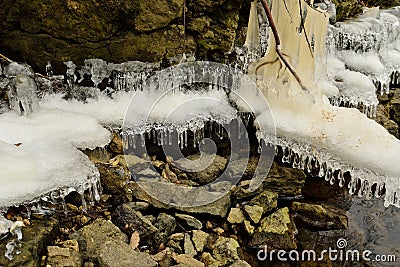 Ice forms on the rocky shores of Root River Stock Photo