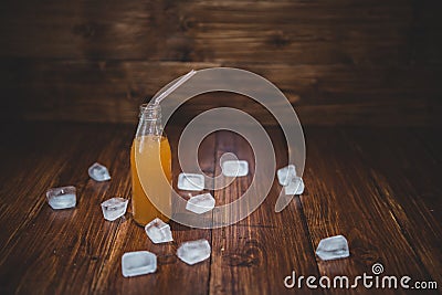 Ice fresh juice with ice cubes on table Stock Photo