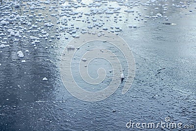 Ice on frozen lake with pieces of snow, close up detail - winter background Stock Photo