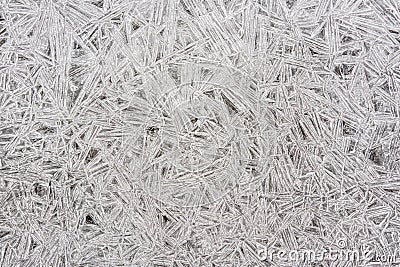 Ice on frozen river forming crystal like structures, closeup macro detail from above - abstract winter background Stock Photo