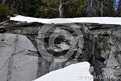 An ice frozen wall of grant with melting water Stock Photo