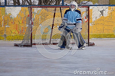Ice hockey goalie in goal face blurred . Stock Photo