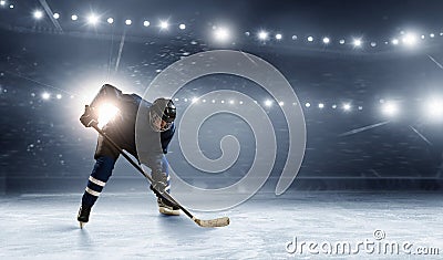 Ice hockey player at rink Stock Photo