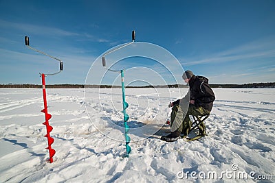 Ice hole fishing competition in Lapland Editorial Stock Photo