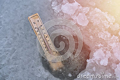 Ice hole fishing. Winter fishing in freezing cold weather concept Stock Photo