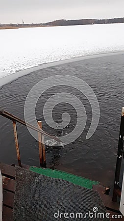 Ice hole. Swimming in ice water. Epiphany. Stock Photo