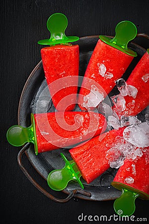 Ice juice and ice in a plate. Healthy summer food concept with copy space Stock Photo