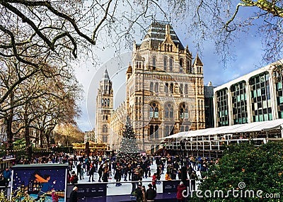 London, UK/Europe; 21/12/2019: Ice rink and Christmas tree at Natural History Museum in London. People enjoying ice skating at Editorial Stock Photo