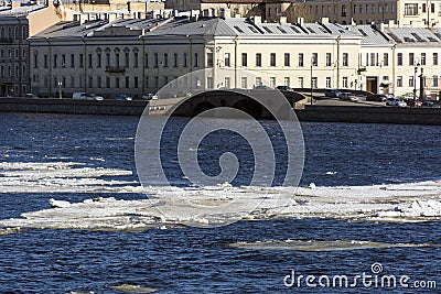 ice on the river, buildings, houses, Windows, roofs, embankment Stock Photo