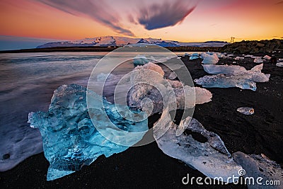 Ice rock on the black sand beach at Diamond Beach, Iceland Summer. Stock Photo