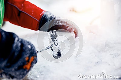 Ice sculpture carving man use chisel cut frozen winter Stock Photo