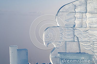 Ice sculpture of eagle. Winter landscape with a view of the Yakutsk city from the hill. The city is hidden under dense Stock Photo