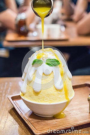 ice shave with mango sauce (mango bingsu) Stock Photo