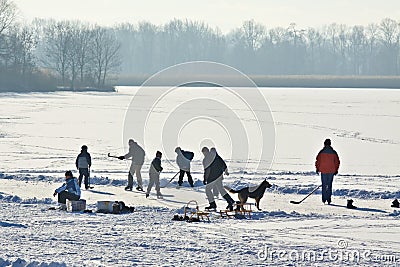 Ice-skating on frozen lake Stock Photo