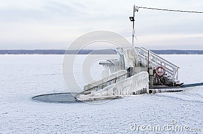 Ice swimming place at cold winter day