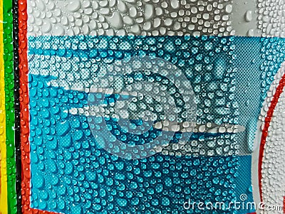 ice water drops on colorful aluminum cans. Stock Photo