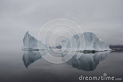 Iceberg along the eastern Baffin Island coastline near the community of Qikiqtarjuaq Stock Photo