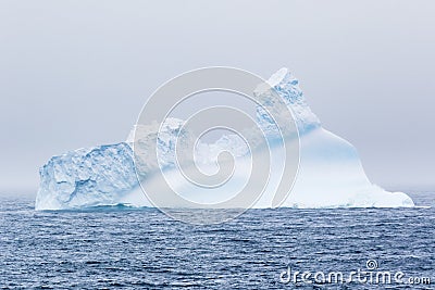 An iceberg floating in the sea Stock Photo